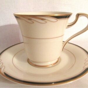 OSCAR DE LA RENTA HOSPITALITY BLACK FOOTED CUPS & SAUCER GOLD TRIM .